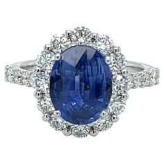 GIA Certified Oval Ceylon Sapphire weighing 2.96 carats Measuring (10.22x7.99x4.51) mm 30 pieces of diamonds weighing 1.26 carats GH-SI1 Set in 18 karat white gold ring 3.57 grams Sapphire And Diamond Ring, Ceylon Sapphire, Sapphire Diamond Ring, Shiny Things, Lady Diana, Sapphire Diamond, White Gold Rings, Cocktail Rings, Beautiful Jewelry