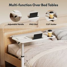 a bed with a laptop on top of it next to a cup holder and coffee mug