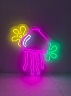 a neon sign with a jellyfish on it