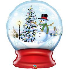 a snow globe with a snowman and a christmas tree in the center, on top of a red ribbon