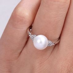 Featuring a lustrous freshwater cultured pearl and dazzling diamond side stones, this Stella Grace ring is a stylish complement to your wardrobe.Click on this JEWELRY & WATCHES GUIDE to learn about fit, styles, materials and more! Width: 8.4 mm Metal: sterling silver Plating: rhodium Finish: polished Packaging: boxedDIAMOND DETAILS Total weight: 1/8 ct. Shape: round Setting: prongCULTURED PEARL DETAILS Type: freshwater Size: 8 mm - 8.5 mm Shape: round Color: white Diamond weights are approximate Diamond White Pearl Ring With Diamond Accents For Promise, Diamond Pearl Promise Ring, Round Diamond Ring With Akoya Pearl And Diamond Accents, White Pearl Ring With Brilliant Cut, White Pearl Ring With Diamond Accents, Diamond White Akoya Pearl Ring For Anniversary, White Diamond Ring With Diamond Accents, Round Akoya Pearl Diamond Ring With Accents, White Pearl Rings With Diamond Accents