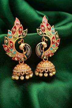 Product Features:   Color: Gold and Multi Color Material: Alloy Product Weight: 75 Gram Occasion: Party Wear Disclaimer: There will be slight difference in digital to actual image Luxury Multicolor Festive Jhumkas, Luxury Multicolor Jhumkas For Celebration, Traditional Peacock Design Danglers For Party, Traditional Peacock Danglers For Party, Party Chandbali Danglers With Peacock Design, Party Peacock Design Chandbali Danglers, Party Peacock Chandbali Danglers, Elegant Multicolor Peacock Design Jhumkas, Festive Peacock Design Party Earrings