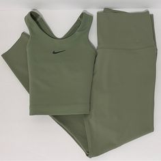 1. Nike Yoga Dri-Fit Swoosh Medium Sports Bra Size: M Color: Oil Green Style: Dm0660-386 Brand New. No Damage Or Stains Retail Price: $40 Medium-Impact Support; Ideal For Running, Training And Cardio. Racerback Dri-Fit Moisture-Wicking Technology 80% Polyester, 20% Spandex 2. Nike Zenvy Women's Gentle-Support High-Waisted 7/8 Leggings Size: M Color: Oil Green Style: Dq6015-386 Brand New. No Damage Or Stains. Without Tag. Retail Price: $100 Size & Fit: Tight Fit: Snug And Form-Fitting Gentle Supp Nike Athleisure Activewear With Compression Fit, Nike Green Activewear For Gym, Green Nike Activewear For The Gym, Casual Nike Activewear For Pilates, Nike Athletic Fit Sportswear, Nike Fitted Activewear For Loungewear, Nike Stretch Activewear For Loungewear, Nike Green Athleisure Activewear, Nike Athleisure Activewear