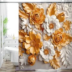 a bathroom with gold and white flowers on the shower curtain that is hanging in front of a bathtub