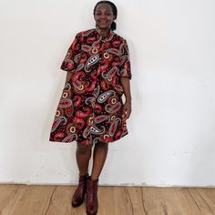 With the shelly dress you are sure to stand out! Our loose fit colourful dresses made out of non-stretchy African print are perfect for you in case you are looking for a style idea that is versatile, comfortable, and looks fabulous year-round. All materials used to design the dresses are sourced in Kenya.  MEASUREMENT GUIDE:  We recommend asking questions about sizes or you can take your own measurements (at the bust) if unsafe. Since its an A- Line, you only need to ensure that you have the rig Casual Oversized Printed Dresses, Red Short Sleeve Shirt Dress For Work, Red Dresses With Pockets Relaxed Fit, Casual Multicolor Knee-length Shirt Dress, Red Dresses With Pockets And Relaxed Fit, Printed Short Sleeve Relaxed Fit Dresses, Short Sleeve Printed Dresses With Relaxed Fit, Short Sleeve Printed Relaxed Fit Dresses, Short Sleeve Relaxed Fit Printed Dress