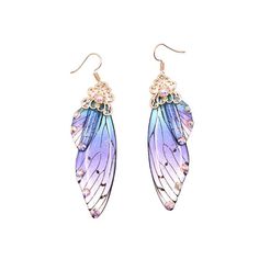 a pair of earrings with purple and blue wings