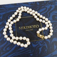 Mikimoto made this wonderful vintage Akoya pearl long 24-inch matinee necklace with their 18k yellow gold signature clasp. There are 23 inches of knotted 8mm to 8.4mm pearls, which are a large size in the world of Mikimoto. Mikimoto is known for the finest quality of cultured pearls and exceptional jewelry design. The akoya pearl is a saltwater cultured pearl from the akoya oyster (Pinctada fucata martensii) known for its perfect round shapes, bright mirror-like luster and neutral colors. These particular pearls are a creamy white color with a slight rose tone. They are highly reflective with a thick nacre, slight surface blemishes and very good uniform roundness. The fancy engraved bow-shaped clasp has a 3.6mm pearl on top. The back of the clasp is marked with an "M" inside of a shell sha Classic Pearl Necklace With Round Beads, Classic Pearl Chain Jewelry, Classic Gold Pearl Necklace, Classic Gold Single Strand Pearl Necklace, Classic Pearl Necklace With Round Beads As Gift, Classic Pearl Necklace Gift, Classic Pearl Necklace As A Gift, Classic Formal Pearl Necklace With Pearl Charm, Classic Single Strand Pearl Necklace Gift