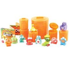 an assortment of toys including plastic containers and figures