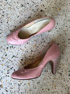 "These babies feature the prettiest rounded toe, little white studs, and the sweetest baby pink leather. Two-toned, as the heels are a slightly different pearly pink than the upper. Estimated size: 6 Length: 9.75\" Width: 3\" Heel height: 3.25\" Circa: 1940's Condition: Good vintage condition. Normal wear. Follow us on Instagram for the latest----> http://instagram.com/closetcasevintage @closetcasevintage Please contact us about any questions you may have regarding condition before purchasing Retro Low Heel Pink Heels, Vintage Pink Heels, Retro Pink Ankle Strap Heels, Pink Vintage Party Heels, 1950s Heels, Vintage Pink Leather Heels, 50s Prom, Pin Up Shoes, Studded Shoes