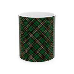 a green and yellow tartan plaid pattern coffee mug on a white background with the words,