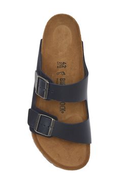 A leather slide sandal is made with Birkenstock's legendary footbed that mimics the shape of your foot and provides excellent support. Support: enhances the fit with targeted contouring and cushioning in the footbed Cushioning: absorbs impact and distributes weight for consistent, buoyant comfort under each step Contoured footbed with arch support Leather upper and lining/synthetic sole Made in Germany Leather Footbed Sandals With Arch Support, Leather Slip-on Footbed Sandals With Arch Support, Classic Slide Sandals With Cushioned Footbed, Classic Slide Footbed Sandals With Cushioned Footbed, Classic Leather Footbed Sandals With Arch Support, Classic Cushioned Slide Footbed Sandals, Classic Adjustable Slides With Leather Footbed, Classic Synthetic Sandals With Leather Footbed, Classic Comfort Slip-on Footbed Sandals