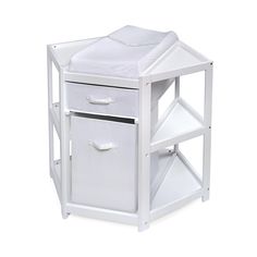 a white wooden night stand with two baskets on the bottom and one drawer open to reveal a bed sheet