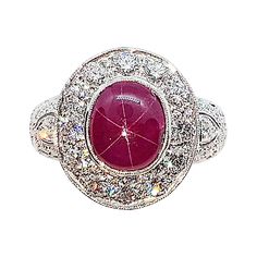 Star Ruby 3.17 carats with Diamond 1.66 carats Ring set in 18 Karat White Gold Settings Width: 0.8 cm Length: 1.0 cm Ring Size: 51 Total Weight: 8.2 grams "We first opened doors in 1980 when it was then situated in the vicinity of the Victory Monument; a small and modest storefront with a couple of counters. From its humble beginnings to where it stands today, our company has proven its abilities as a jeweler. Since the beginning, we have been supplying fine quality pieces to dealers, wholesaler Luxury Ruby Cabochon Diamond Ring, Luxury Ruby And Diamond Oval Cabochon Ring, Luxury Ruby Ring With Oval Cabochon Diamond, Fine Jewelry Ruby Cabochon Ring In White Gold, Fine Jewelry Cabochon Ruby Ring In White Gold, Fine Jewelry White Gold Ruby Ring With Cabochon, Fine Jewelry White Gold Cabochon Ruby Ring, Oval Cabochon Ruby And Diamond Ring, Luxury Oval Cabochon Diamond Ring With Center Stone