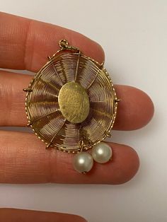 Vintage 14k yellow gold sun hat charm. The charm has two pearls. The charm weighs 2.59 grams of gold. Vintage Gold Jewelry With Akoya Pearl, Vintage Gold Akoya Pearl Jewelry, Yellow Gold Brass Jewelry With Pearl Charm, Heirloom Style Yellow Gold Pearl Jewelry, Heirloom Yellow Gold Pearl Jewelry, 14k Yellow Gold Jewelry With Pearl Charm, Vintage Akoya Pearl Pendant Jewelry, Oval Pearl Pendant In Yellow Gold, Antique Gold Jewelry With Pearl Charm