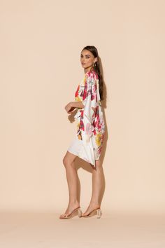 This is one Bouquet you won't want to throw away! Vibrant blooms of flora and fauna adorn this short caftan with tie waist in our signature Polysilk fabric. Dance the night away or lounge in luxe - the occasions are endless with this beautiful, blossoming statement piece. Machine washable for ease of care. Silk V-neck Summer Robe, Spring Kaftan With Kimono Sleeves For Loungewear, Spring Loungewear Kaftan With Kimono Sleeves, Spring Beach Cover-up Kaftan With Tie Waist, Spring Beachwear Kaftan With Tie Waist, Summer Daywear Kimono With Tie Waist, Summer Kimono With Tie Waist For Daywear, Spring Kaftan With Kimono Sleeves For Daywear, Chic Daywear Kaftan For Spring