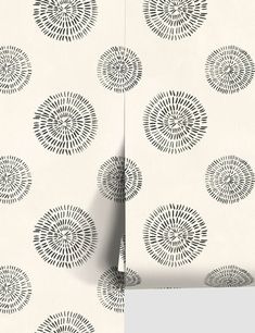 the wall paper is designed with black and white circles on it, as well as an abstract design