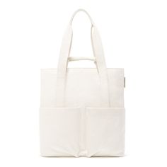 Everyone has a favorite pair of jeans. Ours just happens to come in the form of a bag. Meet the Pacific Tote. Made from 100% organic cotton canvas, this tall tote bag is your perfect (and stylish) partner in crime—especially if those crimes include beach days, grocery runs, and a trip to the gym. But make no mistake, the Pacific Tote is great for work too. It even fits a 13” laptop and has pockets for your phone and small tablet (and even more pockets for the billions of cords you need to make e Double Handle Cotton Canvas Bag For Travel, Casual Bags With Flat Pocket For On-the-go, Eco-friendly Large Capacity Canvas Bag For On-the-go, Casual Canvas Tote Bag With Canvas Lining, Casual Canvas Tote Bag With Lining, Casual Canvas Bag With Canvas Lining For Everyday, Casual Everyday Canvas Bag With Leather Handles, Travel Cotton Softback Shoulder Bag, White Softback Canvas Bag For Everyday Use