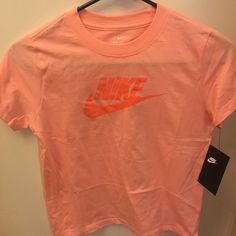 New With Tag Sporty Pink T-shirt With Logo Print, Spring Pink T-shirt With Logo Print, Nike Orange Crew Neck T-shirt, Basic Pink Summer Shirt, Sporty Pink Cotton Top, Basic Pink Cotton Shirt, Basic Pink Top With Letter Print, Basic Pink Tops With Graphic Print, Cute Pink Sports Tops