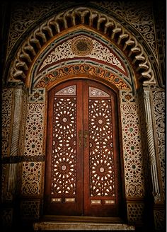 an ornate wooden door with intricate carvings on it