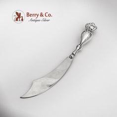 a knife is shown with the name berry & co on it's back end