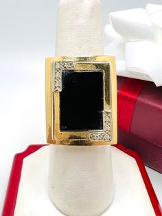 Vintage 14K Yellow Gold Black Onyx & Diamond 0.04ct Ring Size 6.75 A perfect gift for your loved one for any special occasion or holiday! Total Ring Weight: 6.43g Ring Length: 25.58mm Ring Width: 19.81mm Gemstone: Diamond, Star Sapphire Total Diamond: 0.06ct A perfect gift for your loved one for any special occasion or holiday! Total Ring Weight: 6.72g Ring Length: 23.30mm Ring Width: 20.20mm Gemstone: Diamond, Black Onyx Total Diamond: 0.04ct Item will be placed into a gift box. * Black Enamel Diamond Ring As Gift, Gift Diamond Ring With Black Enamel, Formal Black Diamond Ring With Diamond Accents, Formal Black Diamond Ring Stamped 14k, Elegant Diamond Ring With Black Enamel For Gift, Elegant Diamond Ring With Black Enamel As Gift, Elegant Black Enamel Diamond Ring For Anniversary, Modern Black Diamond Anniversary Ring, Black 14k Gold Rings With Diamond Accents