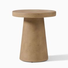 a small round table made out of concrete with a wooden top and base, on a white background