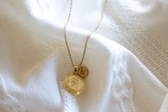 This locket necklace features a charming flower design and a flat circular shape. It serves as a keepsake for your most treasured memories, allowing you to insert a photo within it. Talk about a perfect gift idea! * How To Order 1. Choose the size. 2. Select initials, if you do not want any initial, select "NONE" (UPPER CASE and HEART Shape Available) if you want LOWERCASE please message me BEFORE placing the order!) 3. Add to cart and submit order :) * Locket : Photo Frame Pendant, Flat Round w Silver Medallion Necklace For Anniversary, Initial Pendant Locket Necklace With Charms As Gift, Gift Vintage Charm Initial Pendant Necklaces, Round Pendant Locket Necklace With Charms For Mother's Day, Elegant Charms Locket Necklace For Mother's Day, Gift Vintage Charm Initial Pendant Necklace, Mother's Day Charms Locket Necklace With Round Pendant, Vintage Charm Necklace For Mother's Day, Mother's Day Round Pendant Locket Necklace With Charms