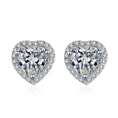 "𝐌𝐚𝐢𝐧 𝐒𝐭𝐨𝐧𝐞 𝐃𝐞𝐭𝐚𝐢𝐥𝐬 ➟Stone Type = Moissanite  ➟Diamond Shape = Heart Cut ➟Diamond Color = FG ➟Diamond Clarity = VVS1 ➟Diamond Creation = Lab-Created ➟Total Carat Weight Approx. = 1.00ct ✥ 𝐒𝐢𝐝𝐞 𝐒𝐭𝐨𝐧𝐞 𝐃𝐞𝐭𝐚𝐢𝐥𝐬  ➟Stone Type = Simulated Diamond ➟Diamond Shape = Round Cut ➟Diamond Color = D ➟Diamond Clarity = VVS1 ➟Total Carat Weight Approx. = 0.25ct *WE OFFER CUSTOMIZATION* If you want to add personal touch to this piece contact us and we will create one just for you. Diamond White Round Cut Earrings For Valentine's Day, Classic Heart-shaped Diamond Earrings For Anniversary, Heart Cut Cubic Zirconia Earrings With Prong Setting, Heart Cut Diamond Earrings With Halo Design, Elegant Round Heart Earrings In Cubic Zirconia, Classic Heart Cut Jewelry With Halo Design, Heart Cut Cubic Zirconia Earrings With Diamond Accents, Elegant Round Cubic Zirconia Heart Earrings, Brilliant Cut Round Heart Earrings For Formal Events