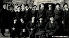 an old black and white photo of a group of people in suits, ties and hats