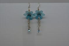 Flower Earrings Lucite Flower Earrings Blue Flower Earrings Blue Dangle Earrings.  Perfect lightweight summer time earrings.  Robins egg blue lucite flowers are joined with silver colored findings to make these cute earrings that are just perfect with a flowing sun dress or just as perfect with t-shirt and shorts. Blue Flower Charm Drop Earrings, Blue Flower Earrings Nickel Free, Nickel-free Blue Flower Earrings, Light Blue Dangle Earrings For Pierced Ears, Handmade Blue Dangle Flower Earrings, Blue Flower Earrings For Jewelry Making, Blue Flower Earrings For Pierced Ears, Blue Dangle Flower Earrings, Blue Flower-shaped Earrings With Ear Wire