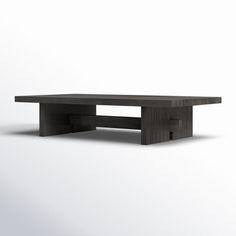 a black table sitting on top of a white floor