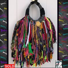 Fringe Handbag Bling,Black with colors,custom made Bag,handmade Purse,Funky,Boho,Chic BEFORE I start with my description i wanted to let you know I CAN WORK WITH ANY BUDGET. I can build a handbag to FIT ANY BUDGET. Just drop me a line and tell me what you want and i'll let you know what type/size/shape/design handbag i can produce for that amount. I can also do layaway plans with a deposit down PLEASE NOTE: The bag pictured has been sold. I can make another bag similar to it, but because my work Bohemian Upcycled Tote Shoulder Bag, Festival Handwoven Black Shoulder Bag, Handwoven Black Shoulder Bag For Festivals, Black Handwoven Shoulder Bag For Festivals, Bohemian Upcycled Multicolor Shoulder Bag, Black Bohemian Hobo Bag, Bohemian Handmade Party Bags, Colorful Bohemian Bags For Festivals, Unique Handmade Party Bag