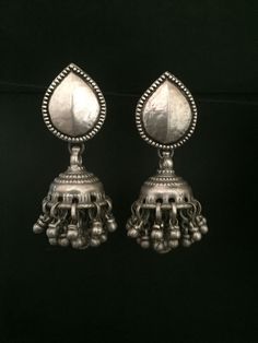 Handmade item (Earring Jumke ) Materials:  Silver Style: Traditional Description:-  Antique silver 925, Gemstone Engagement , Anniversary , Honeymoon, First Date for Women, Traditional Earring - Jhumki , Gift for Her Metal :- SOLID 925 sterling silver  Weight-42.61 grams apx ( Earrings are same as shown in the pictures. We have only one piece in this style and colour, hence you get what you see in the picture ) Package - Individual gift wrapped box How to care:- The sterling material itself is soft, this ring band is thin, please avoid any serious collision and squeezing, because this may make the ring bent or stone fall out, we recommend you to buy a larger half size ring to make finger loose, this will avoid any squeezing. Handmade Jewelry By Vidita Jewels Contact us if any other questio Sterling Silver Dangle Jhumkas For Wedding, Traditional Earrings For Celebration, Silver Oxidized Finish Bridal Earrings As Gift, Traditional Silver Bridal Earrings Hallmarked, Sterling Silver Drop Earrings In Temple Jewelry Style, Sterling Silver Temple Jewelry Danglers, Silver Hallmarked Earrings, Sterling Silver Fusion Danglers, Silver Fusion Style Drop Jhumkas