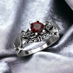 Celebrate your love with a touch of gothic elegance with our Bat Engagement Ring, crafted from premium 925 Sterling Silver. This unique ring features an intricately designed bat, symbolizing mystery and transformation, making it an ideal choice for those who appreciate alternative and gothic jewelry. Perfect for both men and women, this ring is a striking engagement piece that stands out from the traditional. Handmade with exceptional attention to detail, the bat design showcases intricate craft Wedding Ring Victorian Gothic, Spider Wedding Ring, Wedding Ring Gothic, Gothic Ruby Promise Ring, Silver Gothic Rings For Formal Occasions, Gothic Wedding Rings Engagement, Gothic Silver Rings For Anniversary, Silver Gothic Rings For Anniversary, Gothic Silver Ruby Ring Gift