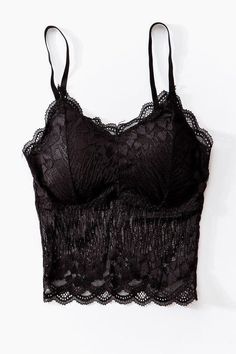 Whether you choose to wear this lace bralette under a baggy tee or give it a peek-a-boo moment with a fitted blazer, the sheer lace and slight padding is sure to make you feel sexy and confident. Elegant Black Lace Top With Built-in Bra, Lace Top With Built-in Bra For Night Out, Party Lace Tops With Bra Friendly Design, Party Lace Tops, Bra Friendly, Party Lace Tops That Are Bra Friendly, Elegant Black Top With Lace Closure, Black Spaghetti Straps Lace Top, Black Delicate Lace Camisole Top, Black Lace Top With Lace Closure