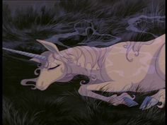 an animated unicorn laying in the grass