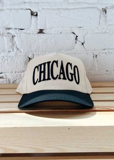 **Exclusive A&W Design** New! Show Chicago some love with this exclusive embroidered Chicago in black on a natural base and black brimmed baseball cap. Adjustable snapback enclosure. One size fits most. Chicago Baby, W Design, Denim Skort, Knit Bottom, Football Tees, Halter Mini Dress, Heather White, Toddler Tees, Long Sleeve Maxi