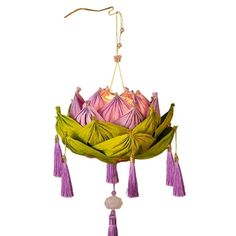 a pink and green hanging decoration with tassels