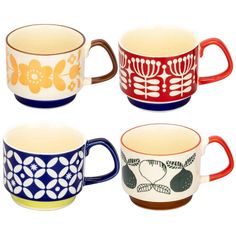 four coffee mugs with different designs on them