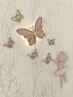 a wall with some butterflies and a fairy on it