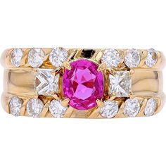 Escape to an era of elegance with our 18K Yellow Gold 0.70 Carat Pink Sapphire Ring, a timeless piece that speaks volumes of sophistication and grace. Crafted with meticulous attention to detail, this ring features a mesmerizing pink sapphire as its centerpiece, radiating warmth and femininity. With a total carat weight of 0.70, the pink sapphire captures attention with its captivating hue, exuding a sense of romance and allure.Surrounding the pink sapphire are dazzling diamonds, totaling 0.94 Carats, set in lustrous 18K yellow gold. The diamonds add a touch of sparkle and brilliance, enhancing the beauty of the ring and creating a stunning contrast against the vibrant pink of the sapphire. This exquisite combination of precious gemstones and luxurious metal makes this ring a true statemen Pink Diamond Accented Fine Jewelry For Wedding, Elegant Pink Diamond Ring For Anniversary, Elegant Pink Diamond Anniversary Ring, Fine Jewelry Pink Ring With Center Stone, Luxury Pink Diamond Ring For Anniversary, Formal Pink Diamond Ring With Gemstone, Pink Diamond Wedding Ring With Center Stone, Fine Jewelry Pink Diamond Ring, Classic Pink Ruby Ring For Anniversary