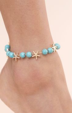 Online only! Enhance your beach style with Ettika's Starfish & Turquoise Beaded Anklet, adorned with turquoise beaded accents and playful starfish charms. This anklet adds a touch of coastal charm and bohemian elegance to your summer look.


	18k Gold Plated, Zinc, Reconstructed Turquoise
	8" with 1" extender
	Lobster Clasp Starfish-shaped Beaded Beach Jewelry, Summer Beach Anklets With Starfish Charm, Summer Strand Anklet With Starfish Charm, Starfish Anklets For Summer Vacation, Adjustable Starfish Anklet For Summer, Summer Bracelets With Starfish Charm, Summer Ocean-inspired Jewelry With Star Charm, Summer Vacation Starfish Anklets, Summer Ocean-inspired Star Charm Jewelry