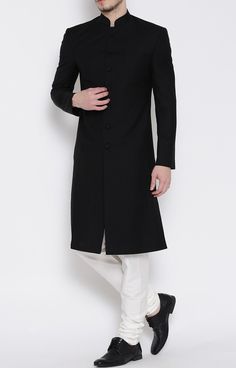 Nawabi style Indian royal wedding sherwani made in black color pure polyester fabric. It has bottom as matching white cotton churidar pajama. 7 black fabric button Groom and groomsmen wedding dress Occasion: Wedding, Sangeet, Cocktail, Evening wear etc. We are given sizes according chest measurements - 34, 36, 38, 40, 42, 44, 46, 48, 50 and custom made For custom made order:- You should select custom made option from size box then place the order. After received your order we will send you a mea Black Nawabi For Men, Classic Black Formal Kurta, Traditional Black Tuxedo For Groom, Traditional Black Groom Tuxedo, Black Dabka Sherwani For Groom, Elegant Black Bandhgala Straight Kurta, Black Long Sleeve Traditional Wear For Groom, Classic Fitted Sherwani For Eid, Fitted Classic Traditional Wear For Wedding