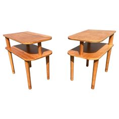 two wooden tables sitting side by side on top of each other with one end open