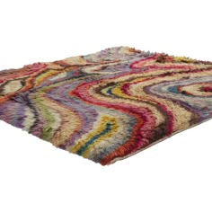 a multicolored area rug on white background