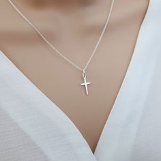 Small cross necklace, sterling silver cross necklace women, cross pendant, religious catholic jewelry, tiny cross necklace Our small cross necklace is super dainty & minimalistic - perfect for layering with other necklaces. Would make the perfect meaningful gift for yourself or someone special.  Explore our gorgeous collection of dainty and personalised necklaces and bracelets. Lovingly handcrafted for you, our beautiful, collectable pieces combine minimalism and personalisation.  https://www.et