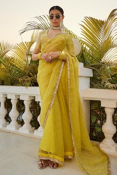 Lime yellow saree with badla placement embroidery and gota embellished border. Paired with mukaish work padded blouse. - Aza Fashions Festive Yellow Pre-draped Saree With Mirror Work, Yellow Tissue Silk Pre-draped Saree For Navratri, Yellow Traditional Wear With Mirror Work In Tissue Silk, Yellow Chanderi Saree For Reception, Yellow Chanderi Traditional Wear For Reception, Yellow Pre-draped Saree With Mirror Work For Wedding, Fitted Yellow Pre-draped Saree With Mirror Work, Yellow Fitted Saree With Mirror Work, Fitted Yellow Saree With Mirror Work