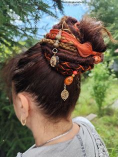 Enhance your witchy vibes with this unique Dreadlock Ponytail! This set features synthetic dreadlocks in striking red and brown hues, secured on an elastic band for easy wear. Perfect for adding a touch of flair to your hairstyle, whether you're headed to a festival, costume party, or just want to express your mystical side. Embrace your whimsical style with this eye-catching hair accessory! 🌞This is a unique piece and I'm happy to create similar ones on request.  Handmade with love, this acces Dreadlock Ponytail, Witchy Hair, Bohemian Hair Accessories, Dreadlocks Hairstyles, Festival Costume, Dreadlock Beads, Synthetic Dreadlocks, Whimsical Style, Synthetic Dreads