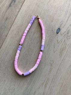 This is a chocker necklace. It has some pastel colors in it. Very comfortable. Trendy Pink Beaded Necklaces With Heart Beads, Casual Pink Beaded Necklace With Heart Beads, Casual Pink Necklace With Round Beads, Trendy Pink Choker With Round Beads, Trendy Pink Necklace With Letter Beads, Trendy Pink Beaded Choker, Trendy Pink Beaded Choker Necklaces, Pastel Beaded Necklaces With Round Beads, Trendy Pink Summer Choker