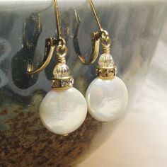 Adjustable White Pearl Earrings For Anniversary, Handmade White Crystal Round Earrings, Handmade White Crystal Earrings, Gift Pearl Drop Crystal Earrings, Elegant Adjustable Crystal Earrings, White Crystal Pearl Drop Earrings As Gift, Classic Pearl Drop Crystal Earrings For Gift, Elegant Nickel-free Mother Of Pearl Earrings, Pearl Teardrop Crystal Earrings As Gift